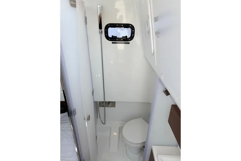 Slide: The Image of Bathroom interior of 2026 Wellcraft 38 T-Top boat with shower and toilet. - 12