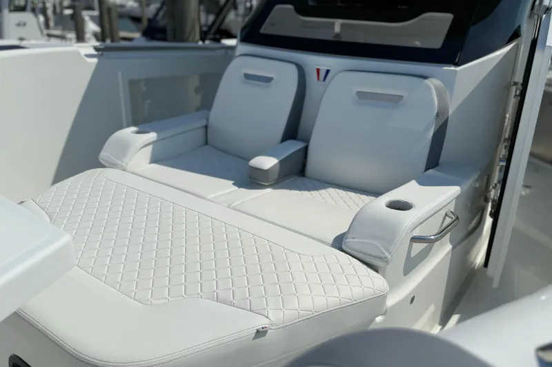 Slide: The Image of Luxurious seating on 2026 Wellcraft 38 T-Top boat with quilted upholstery and armrests. - 15