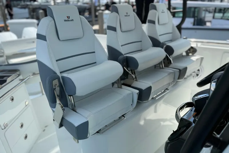 Slide: The Image of 2026 Wellcraft 38 T-Top boat seats, luxurious design, white and gray upholstery. - 19
