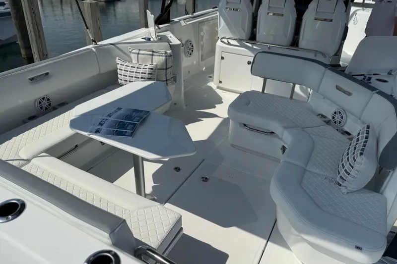 Slide: The Image of 2026 Wellcraft 38 T-Top boat interior with luxurious seating and modern design. - 23