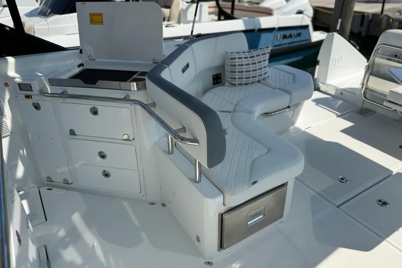 Slide: The Image of Luxurious seating and grill area on 2026 Wellcraft 38 T-Top boat deck. - 29