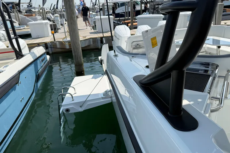 Slide: The Image of 2026 Wellcraft 38 T-Top boat docked at marina, showcasing sleek design and modern features. - 5