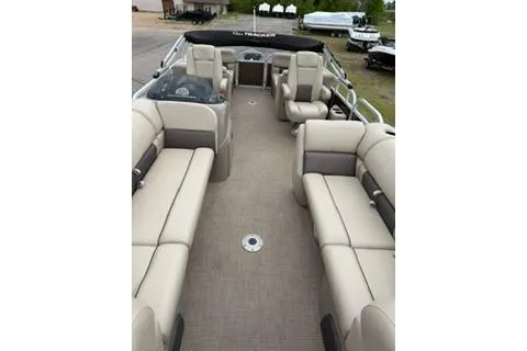 Slide: The Image of 2022 SUNTRACKER Party Barge 22 interior with beige seating and spacious layout. - 5