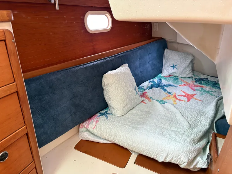 Slide: The Image of Interior of a 2000 Catalina 36 MkII yacht, cozy sleeping cabin. - 22