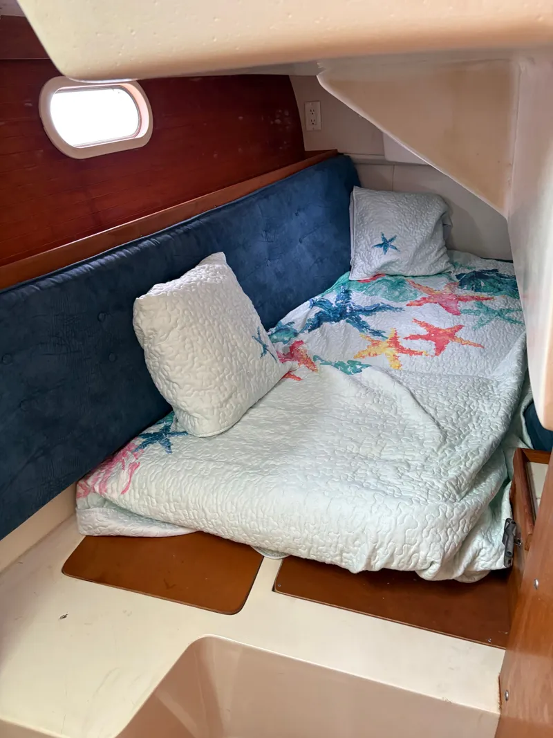 Slide: The Image of Interior of a 2000 Catalina 36 MkII yacht, cozy sleeping cabin. - 23