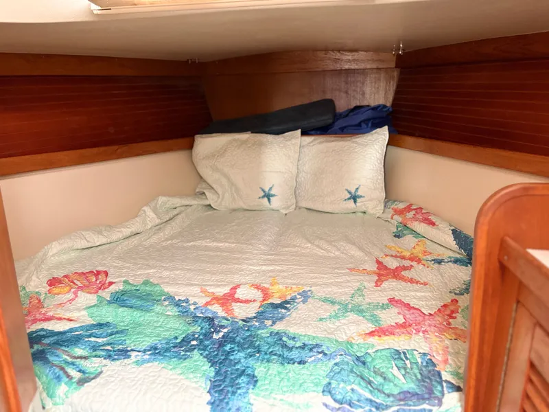 Slide: The Image of Interior of a Catalina 36 MkII yacht with nautical-themed bedding. - 26