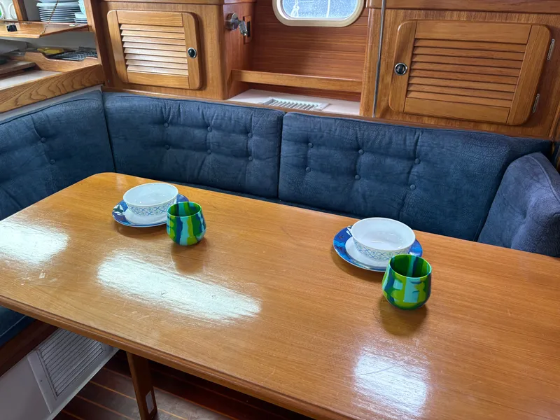 Slide: The Image of Interior of Catalina 36 MkII yacht, dining area with table and dishes. - 30