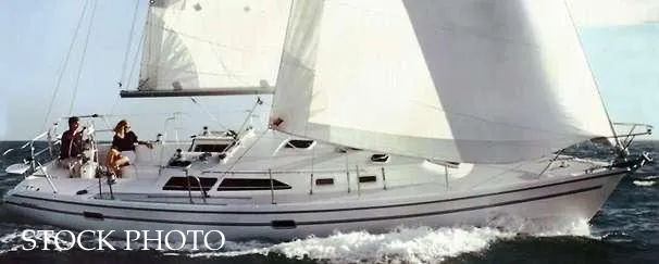 Slide: The Image of 2000 Catalina 36 MkII sailboat navigating open waters. - 43
