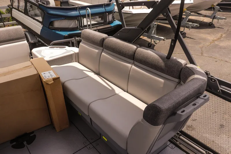 Slide: The Image of 2026 Sea-Doo Switch Cruise 21 interior with comfortable seating and storage boxes. - 11
