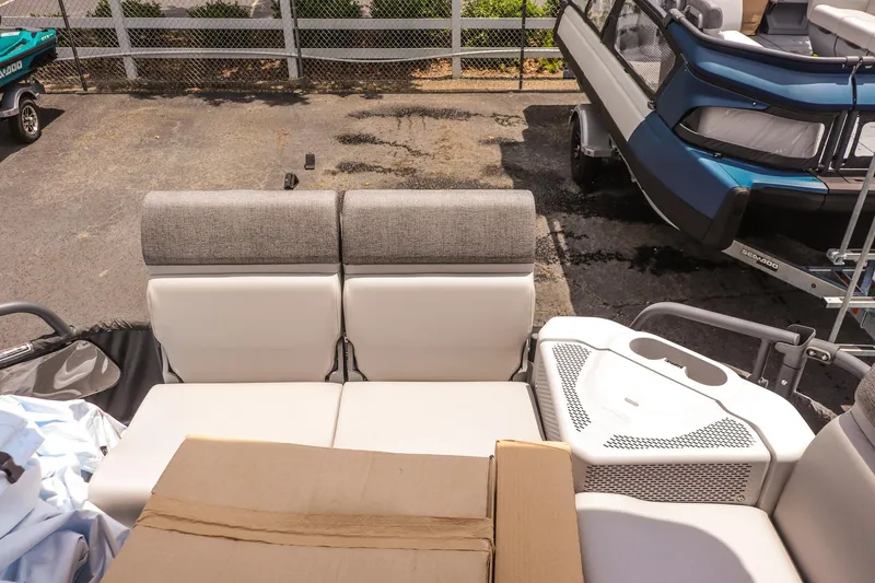 Slide: The Image of 2026 Sea-Doo Switch Cruise 21 interior with comfortable seating and storage area. - 12