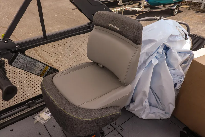 Slide: The Image of 2026 Sea-Doo Switch Cruise 21 seat with gray upholstery and surrounding equipment. - 13