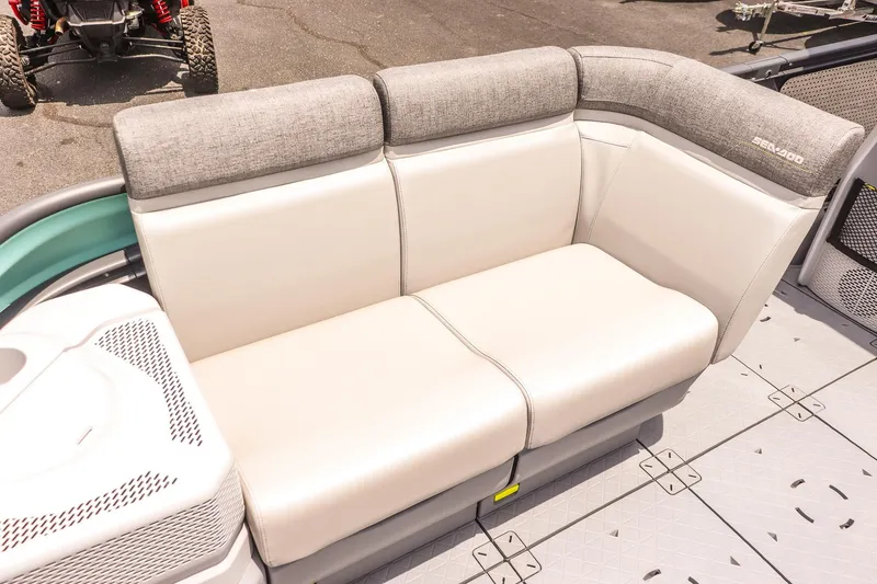 Slide: The Image of 2026 Sea-Doo Switch Cruise 21 boat seating with gray and white upholstery. - 9