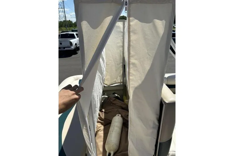 Slide: The Image of 2004 Bennington 2075 FS boat interior with canopy and marine equipment. - 13
