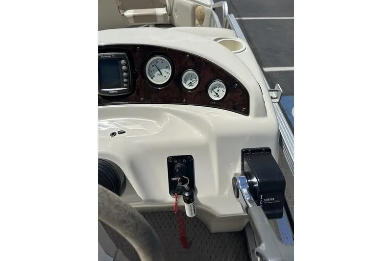 Slide: The Image of Dashboard of a 2004 Bennington 2075 FS boat with gauges and controls. - 15