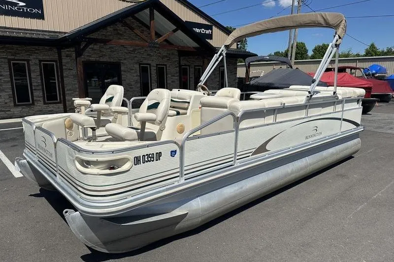 Slide: The Image of 2004 Bennington 2075 FS pontoon boat parked outside dealership on sunny day. - 3