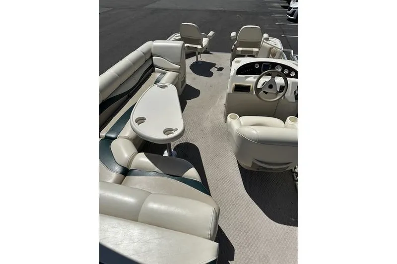 Slide: The Image of 2004 Bennington 2075 FS pontoon boat interior with seating and steering console. - 9