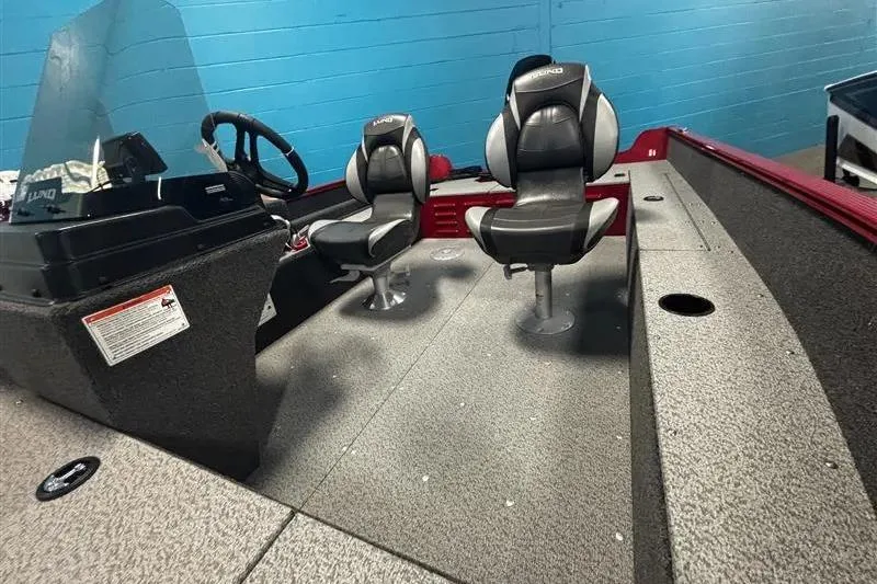 Slide: The Image of 2026 Lund 1650 Angler SS boat interior with dual seats and steering console. - 5