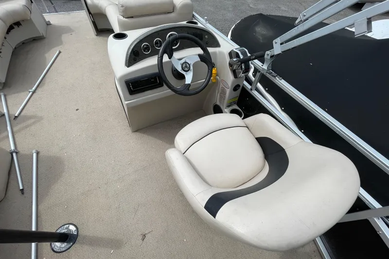 Slide: The Image of 2010 Harris FloteBote 200 Cruiser CX boat interior with steering console and seating. - 11