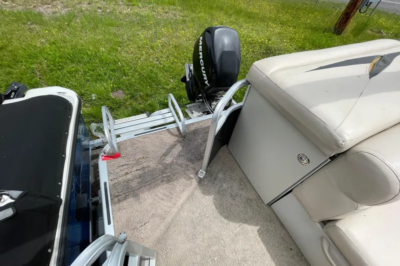 Slide: The Image of 2010 Harris FloteBote 200 Cruiser CX with Mercury outboard motor and seating area. - 5