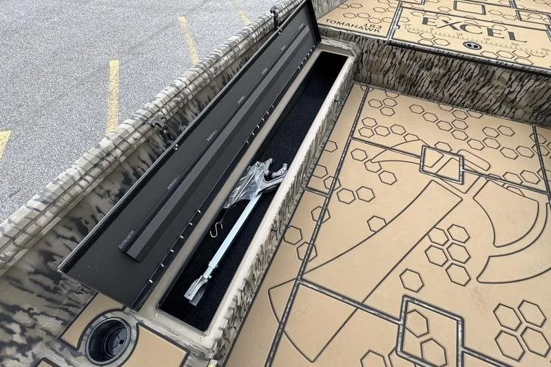Slide: The Image of 2026 Excel 183 Tomahawk boat storage compartment with anchor and patterned flooring. - 10