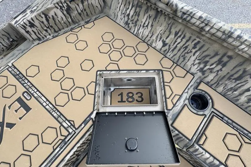 Slide: The Image of Excel 183 Tomahawk 2026 boat interior with hexagonal pattern design. - 14