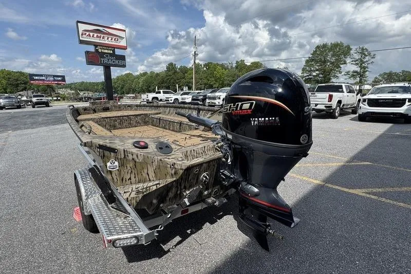 Slide: The Image of 2026 Excel 183 Tomahawk boat with Yamaha engine on trailer at dealership. - 24