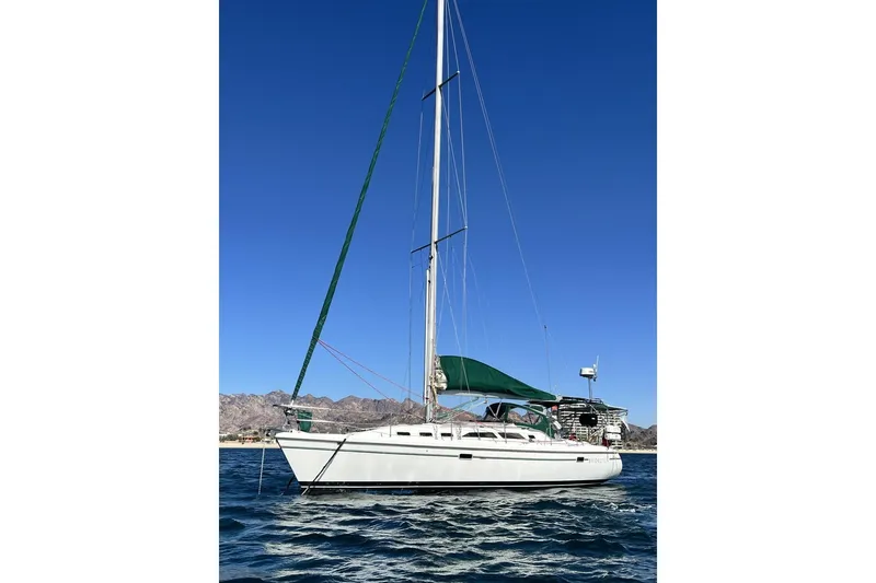 The Image of Sailboat Catalina 380, 1999 model, on water with clear blue sky background. - 1
