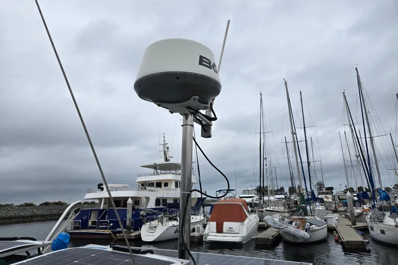 Slide: The Image of Marina with Catalina 380 sailboat, radar equipment, and overcast sky. - 23