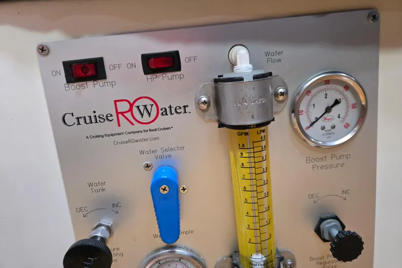 Slide: The Image of Control panel of a 1999 Catalina 380 with water flow and pressure gauges. - 31