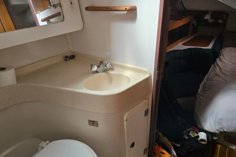 Slide: The Image of Bathroom and cabin interior of a 1999 Catalina 380 sailboat. - 35