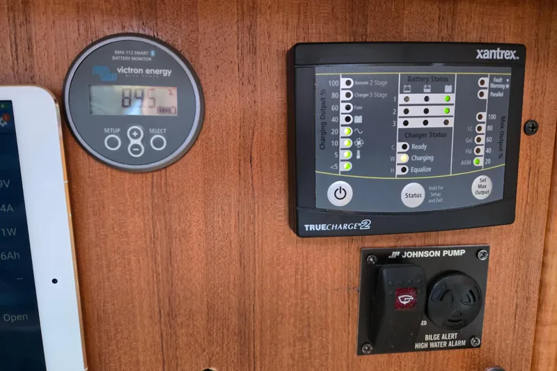 Slide: The Image of Control panel of a 1999 Catalina 380 sailboat with battery monitor and charger. - 44