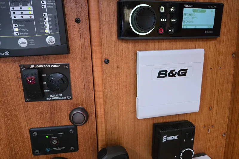 Slide: The Image of Control panel of a 1999 Catalina 380 sailboat with navigation and audio systems. - 45