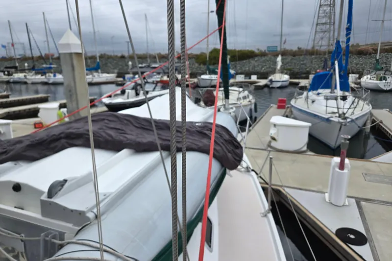 Slide: The Image of Sailboats docked at a marina, featuring a 1999 Catalina 380. - 5