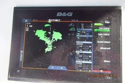 Slide: The Image of B&G marine navigation display showing radar data on a Catalina 380, 1999 model. - 54