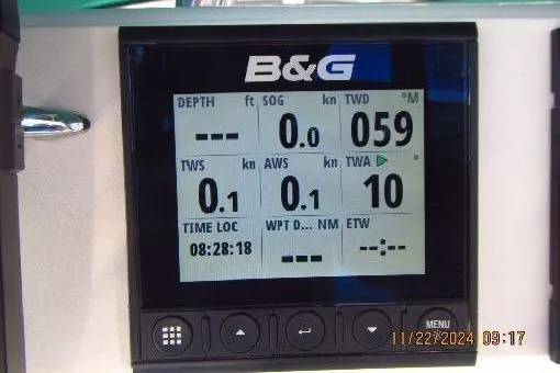 Slide: The Image of B&G marine display on a 1999 Catalina 380 sailboat, showing navigation data. - 56