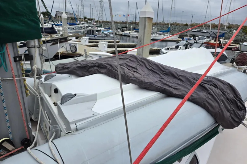 Slide: The Image of Sailboat Catalina 380 (1999) docked at marina with a cover on deck. - 7