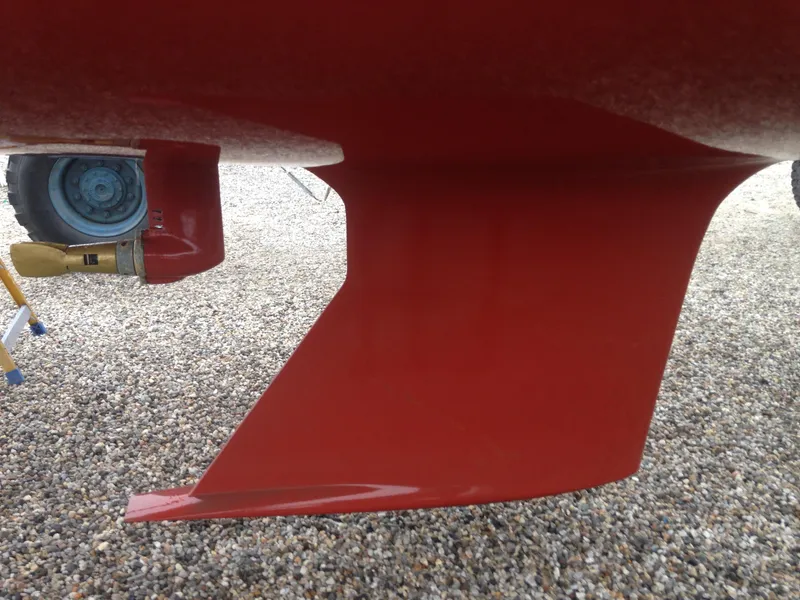 Slide: The Image of Red keel of a 2008 e33 sailing yacht on gravel. - 20