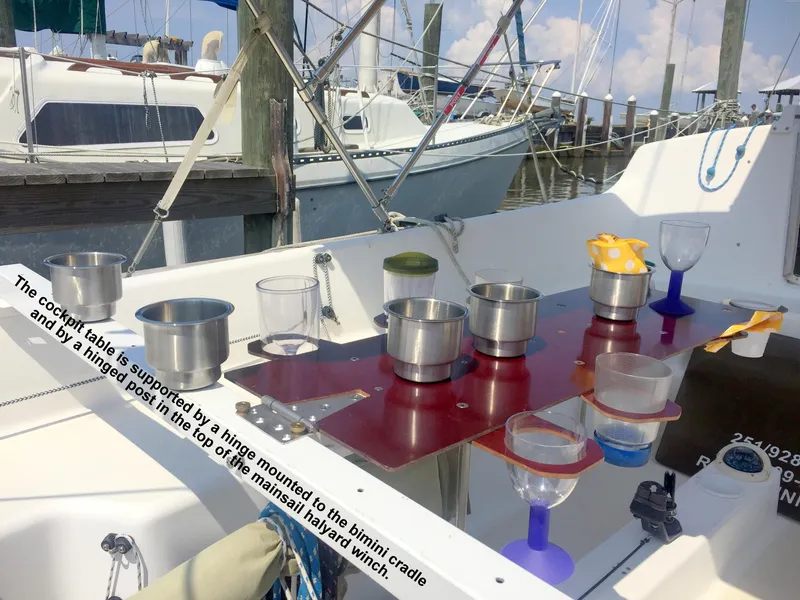 Slide: The Image of Cockpit of a 2008 e33 sailing yacht with table and cups. - 26