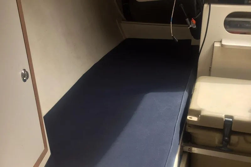 Slide: The Image of Interior of a 2008 e33 sailing yacht with blue upholstery. - 35
