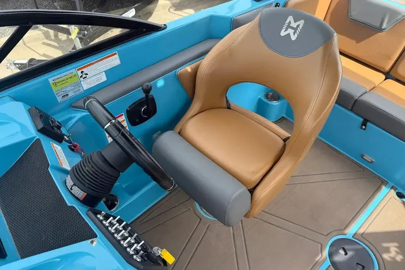 Slide: The Image of 2022 Heyday WT-2DC boat interior with tan seat and blue accents. - 12