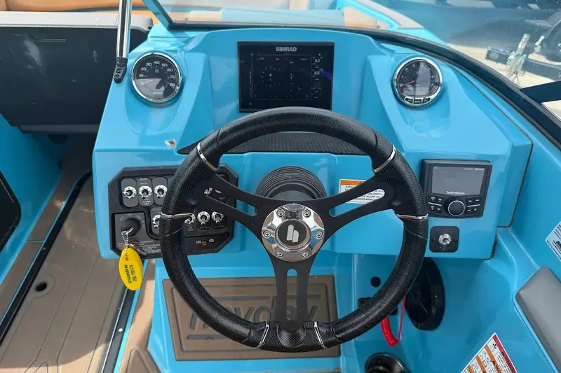 Slide: The Image of 2022 Heyday WT-2DC boat dashboard with steering wheel and control panel. - 14
