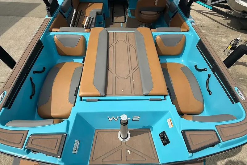 Slide: The Image of 2022 Heyday WT-2DC boat interior with blue and tan seating, showcasing modern design. - 21