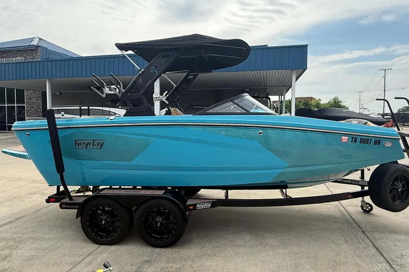 Slide: The Image of 2022 Heyday WT-2DC boat on trailer, blue, side view. - 4