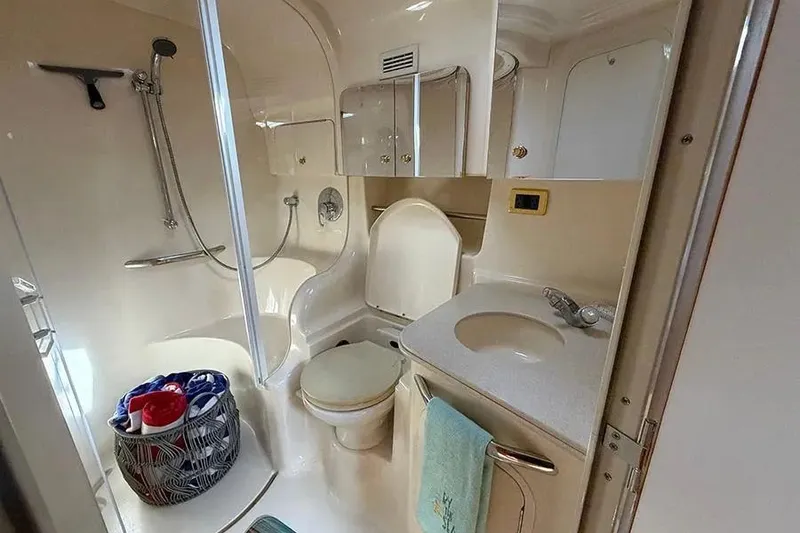 Slide: The Image of Bathroom interior of 2003 Sea Ray 410 Express Cruiser with shower and sink. - 11