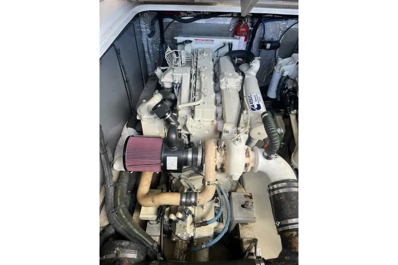 Slide: The Image of Engine compartment of a 2003 Sea Ray 410 Express Cruiser, showcasing detailed components. - 12