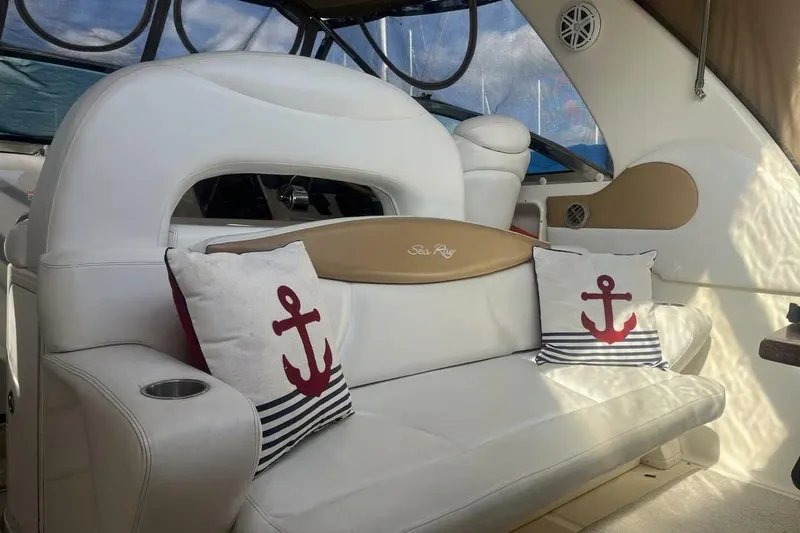 Slide: The Image of Luxurious 2003 Sea Ray 410 Express Cruiser interior with anchor-themed cushions. - 5