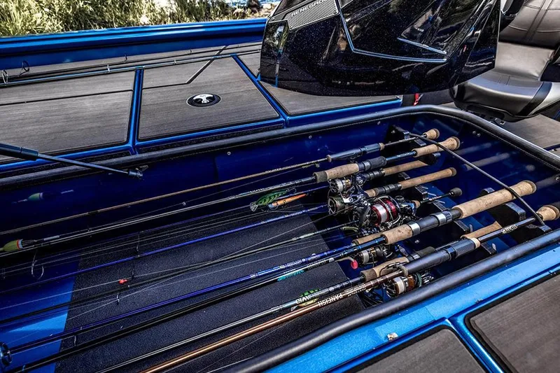 Slide: The Image of Manufacturer Provided Image: Fishing rods stored in a 2025 Lund 1975 Renegade boat's compartment. - 23