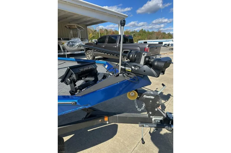 Slide: The Image of 2026 Lund 1975 Renegade boat with Minn Kota motor on trailer. - 3