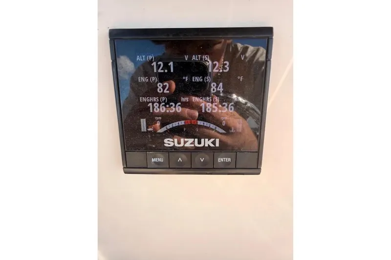 Slide: The Image of Suzuki engine display on 2019 Sea Chaser 24 HFC boat showing various metrics. - 10