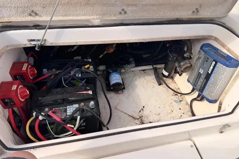 Slide: The Image of 2019 Sea Chaser 24 HFC boat compartment with batteries and electrical components. - 11